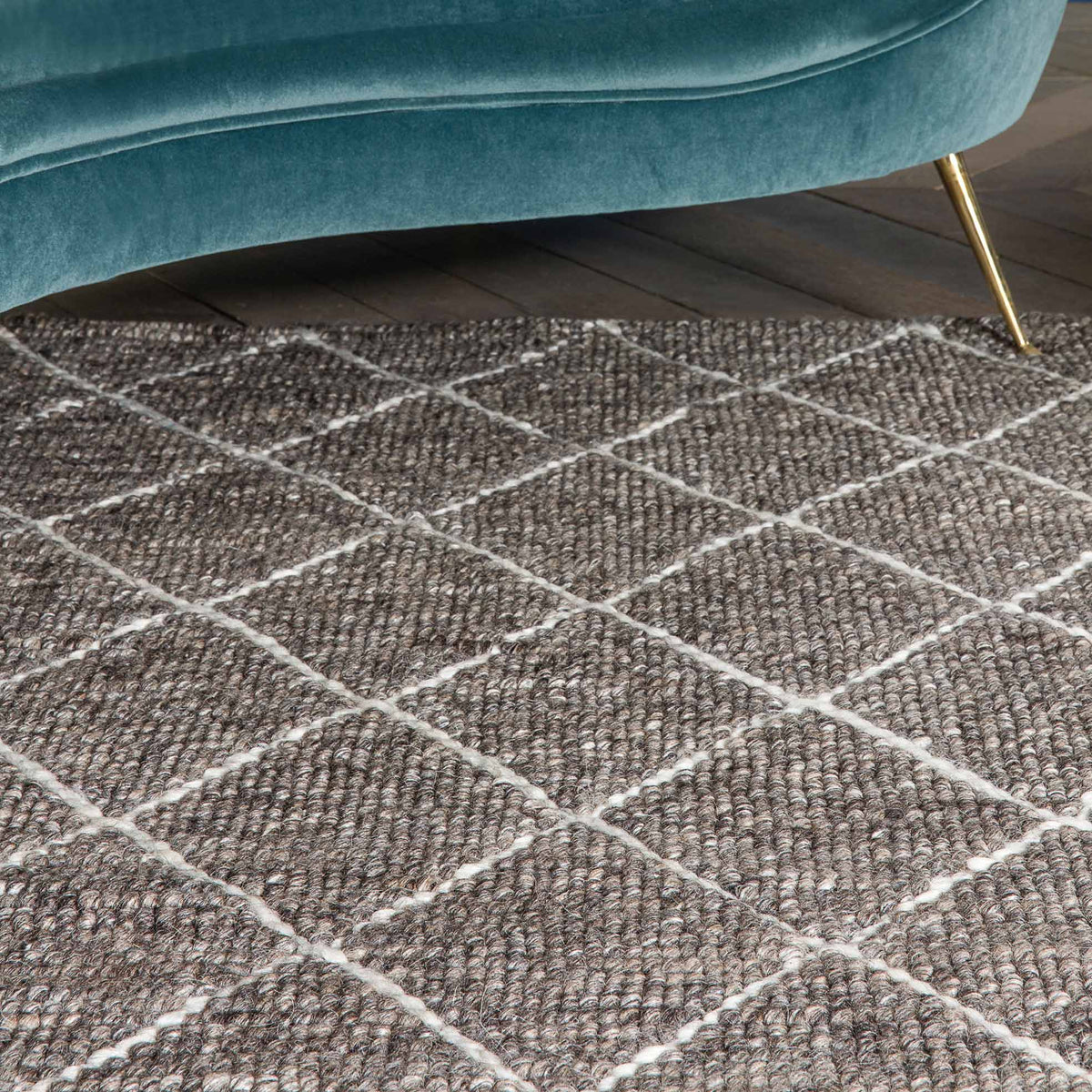 Framework 229.001.900 Hand Woven Rug by Ligne Pure, showing closeup view of framework hand wovn rug in live shot.