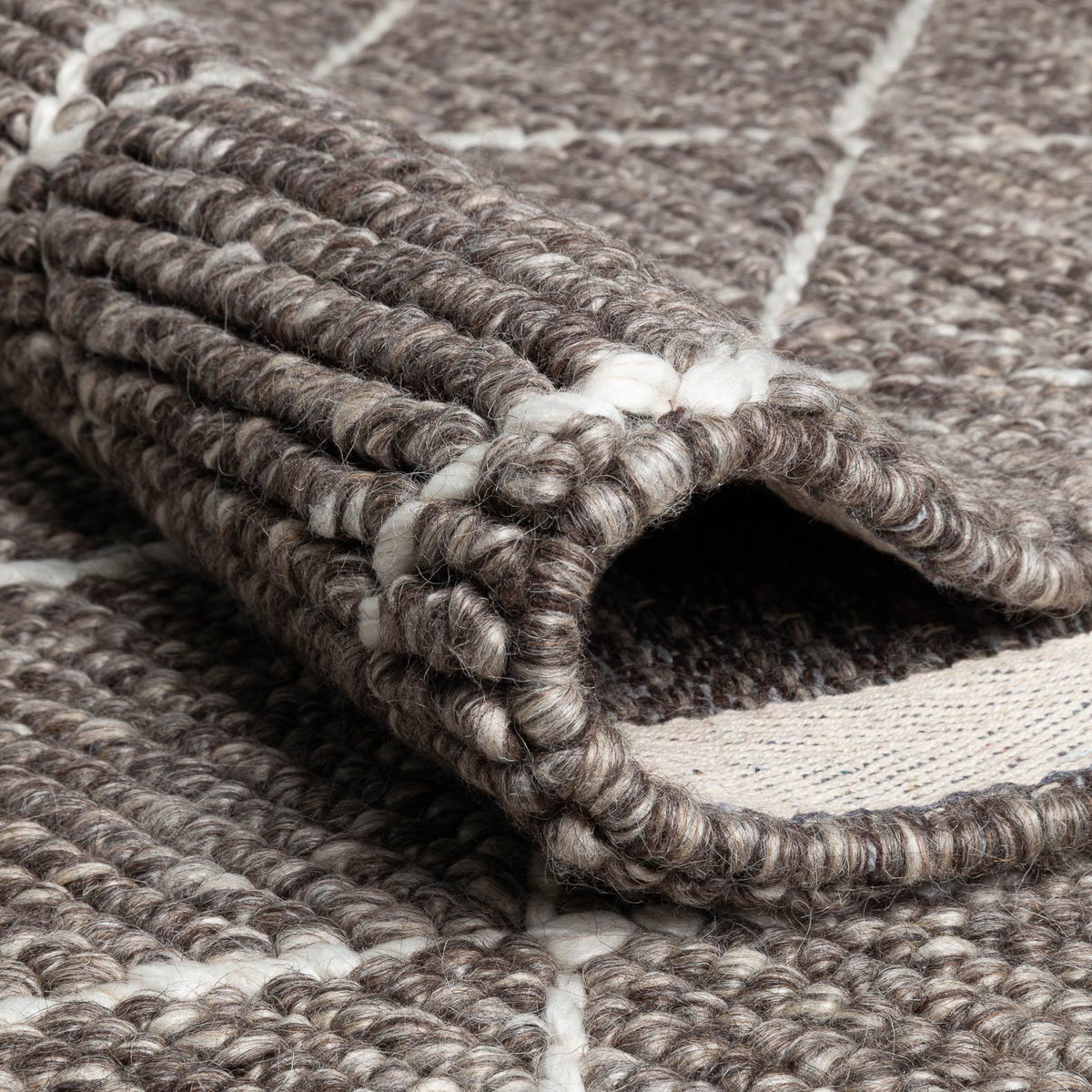 Framework 229.001.900 Hand Woven Rug by Ligne Pure, showing closeup view of framework hand wovn rug.