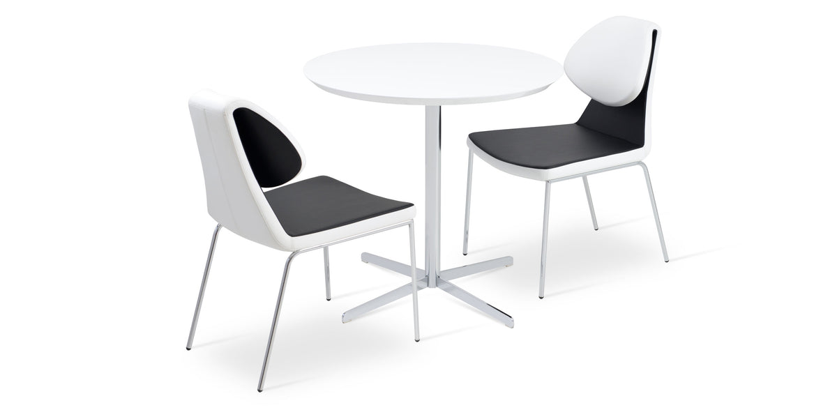 Gakko Dining Chair by SohoConcept, showing two dining chairs with table.