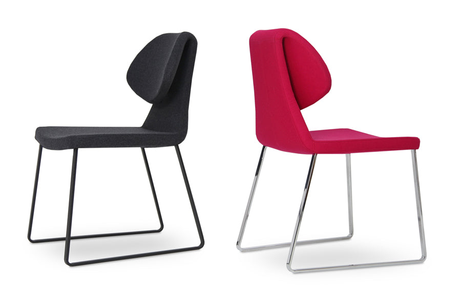 Gakko Slide Dining Chair by SohoConcept, showing side view of two gakko sled dining chair in charcoal grey & pink wool.