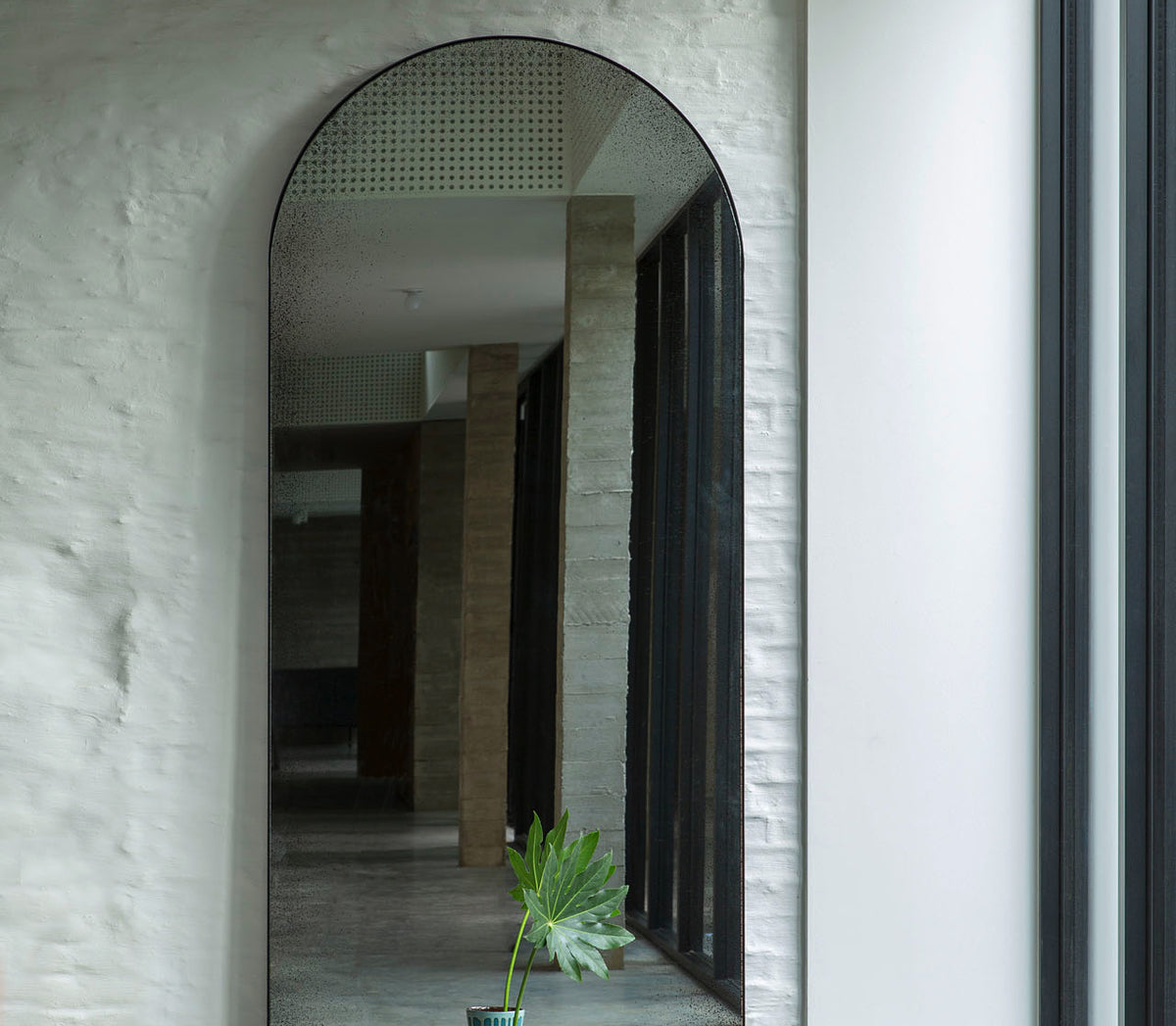 Gate Floor Mirror by Ethnicraft, showing front view of gate floor mirror in live shot.