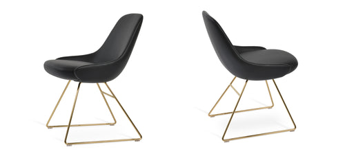 Gazel Wire Chair by SohoConcept, showing two chairs in black leatherette with gold-brass base.