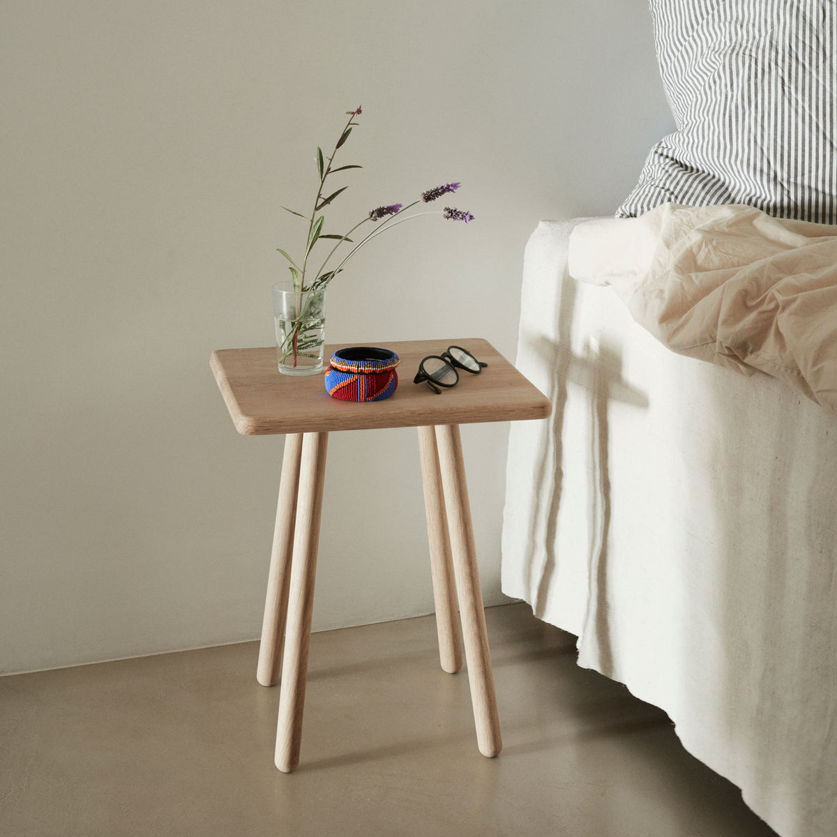 Georg Side Table by Skagerak, showing georg side table in live shot.