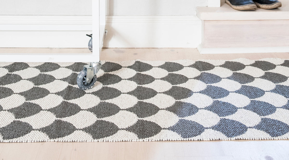 Gerda Woven Plastic Rug by Brita, showing closeup view of gerda woven plastic rug in live shot.