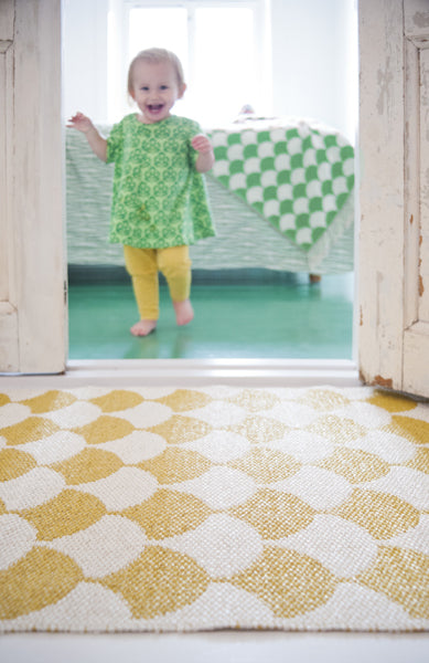 Gerda Woven Plastic Rug by Brita, showing closeup view of gerda woven plastic rug in live shot.