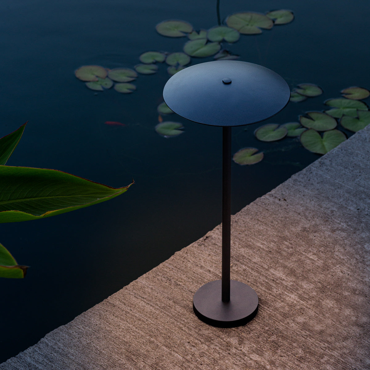 Ginger Bollard Outdoor Light by Marset, showing ginger bollard outdoor light in live shot.