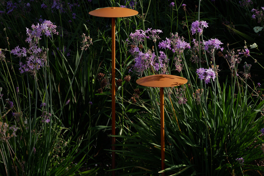 Ginger Bollard Outdoor Light by Marset, showing ginger bollard outdoor lights in live shot.