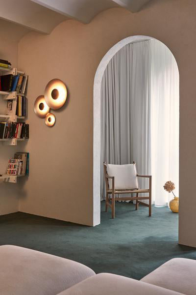 Ginger Dual Dimmable Wall Sconce by Marset, showing ginger dual dimmable wall sconces in live shot.