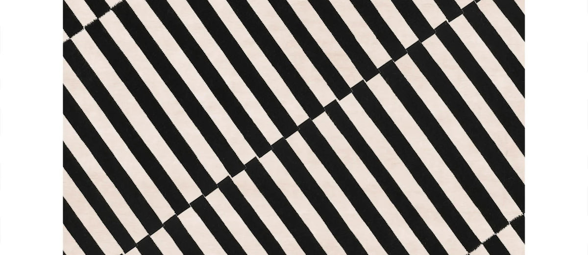 Guspini GI100 Rug by Second Studio, showing closeup view of guspini gi100 rug by second studio in off-white & black.