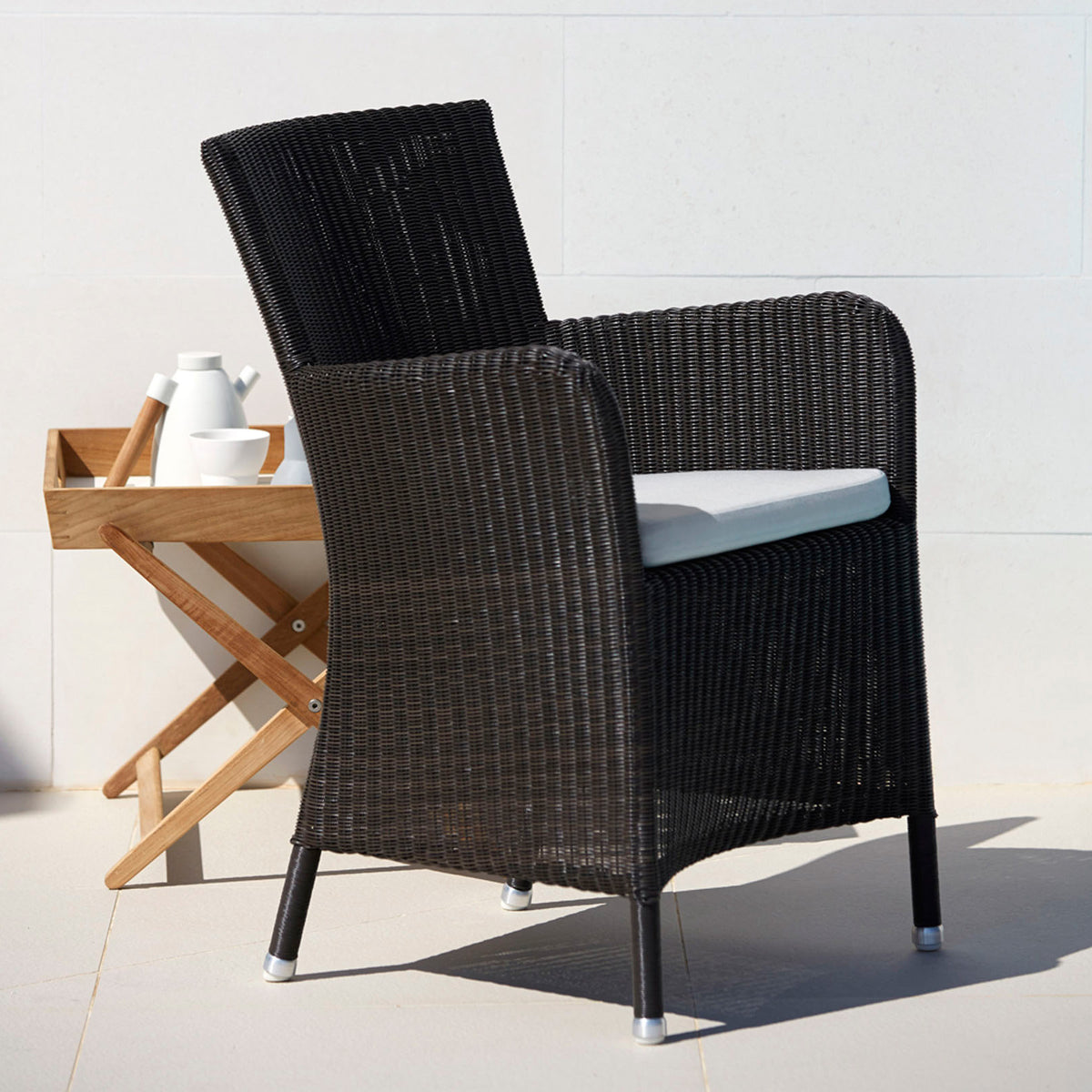 Hampsted Outdoor Dining Chair by Cane-Line, showing hampsted outdoor dining chair in live shot.