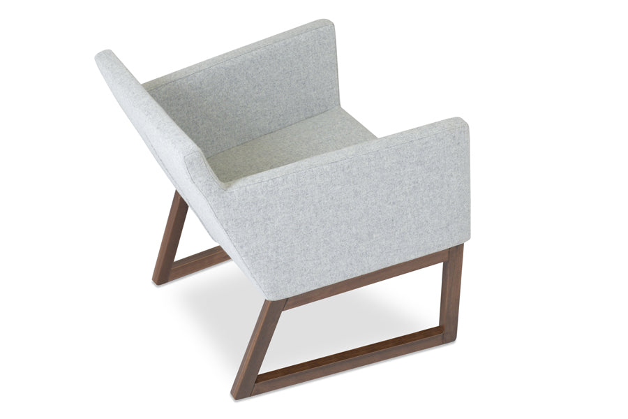 Harput Sled Base Lounge Wood Chair by SohoConcept, showing side view of harput sled base lounge chair in silver camira wool with walnut base.
