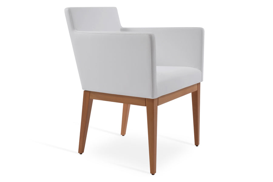 Harput Wood Arm Chair by SohoConcept, showing angle view of wood arm chair in white leatherette in natural wood base.