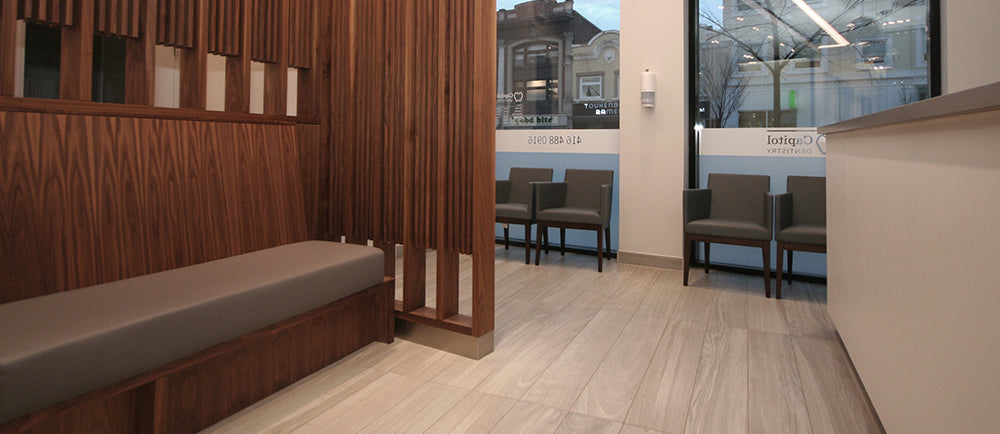 Harput Wood Arm Chair by SohoConcept, showing wood arm chairs in live shot.