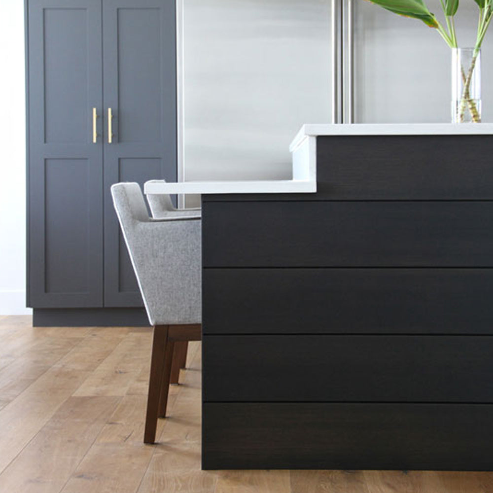 Harput Wood Arm Chair by SohoConcept, showing wood arm chairs in live shot.