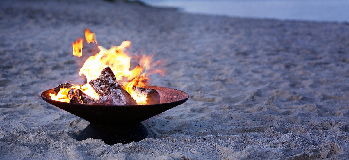 Helios Outdoor Firebowl by Skagerak, showing helios outdoor firebowl in live shot.