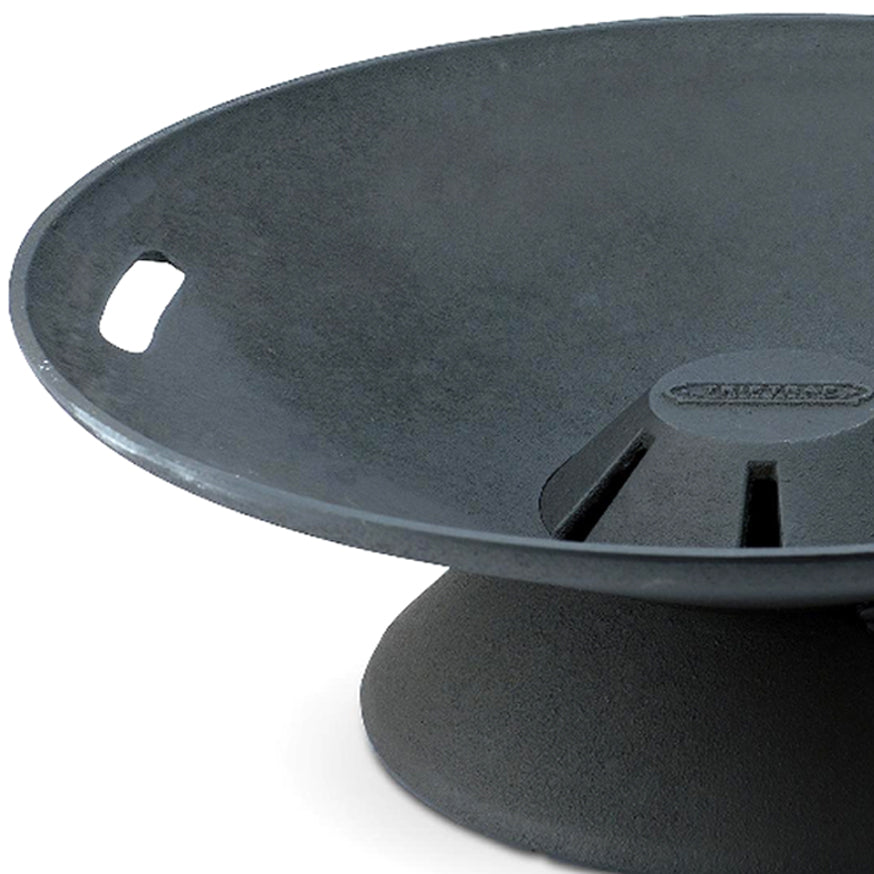 Helios Outdoor Firebowl by Skagerak, showing closeup view of helios outdoor firebowl in dark/matte cast iron.
