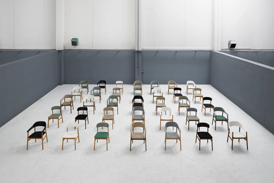 Herit Armchair by Normann Copenhagen, showing herit armchairs in live shot.