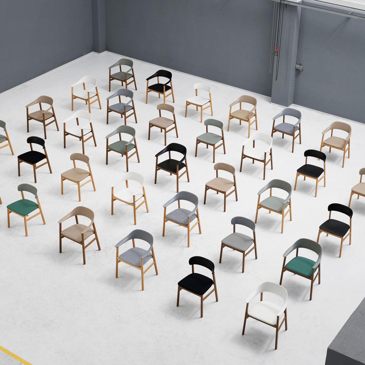 Herit Armchair by Normann Copenhagen, showing herit armchairs in live shot.