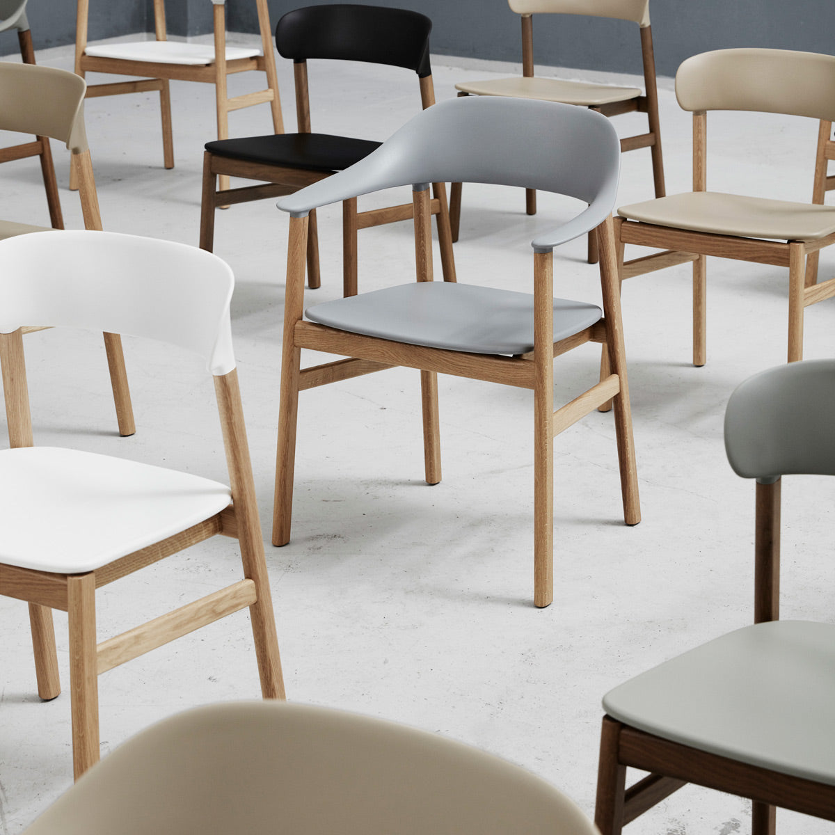 Herit Armchair by Normann Copenhagen, showing herit armchairs in live shot.