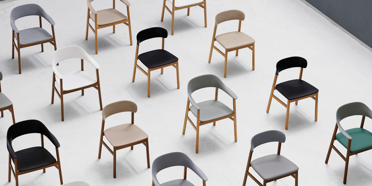 Herit Chair by Normann Copenhagen, showing herit chairs in live shot.