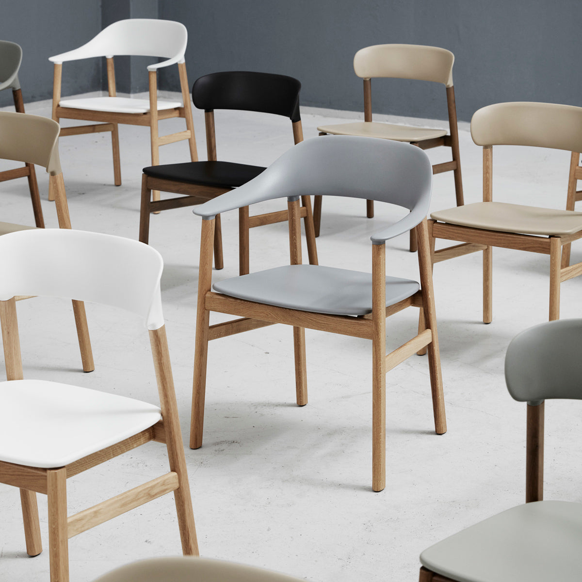 Herit Chair by Normann Copenhagen, showing herit chairs in live shot.