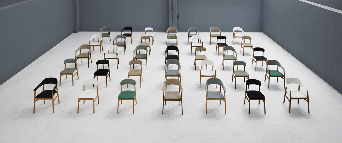 Herit Upholstery Armchair by Normann Copenhagen, showing herit upholstery armchairs in live shot.