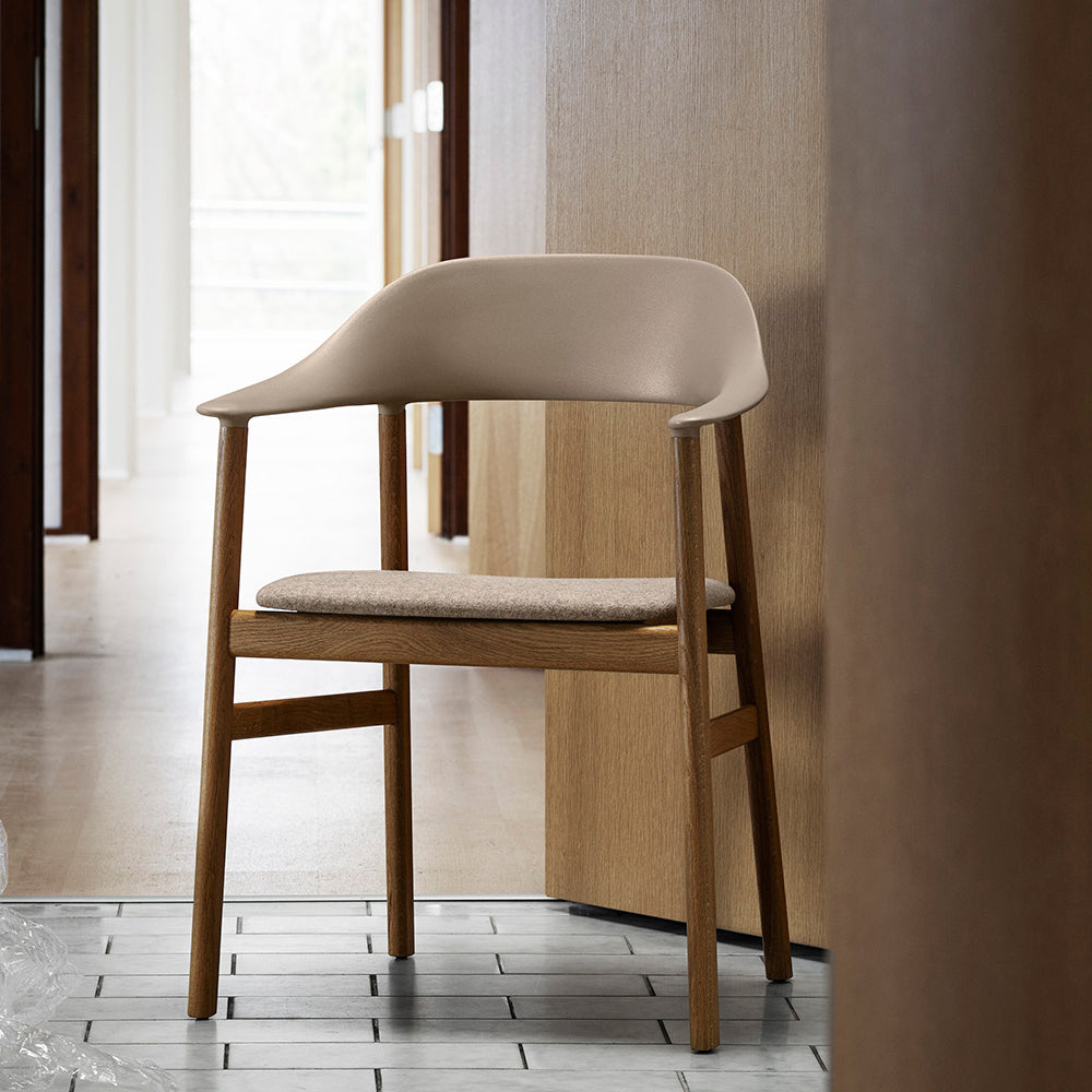 Herit Upholstery Armchair by Normann Copenhagen, showing herit upholstery armchair in live shot.