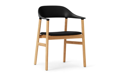 Herit Upholstery Armchair by Normann Copenhagen - Oak Wood Legs, Black Synergy Fabric Seat.