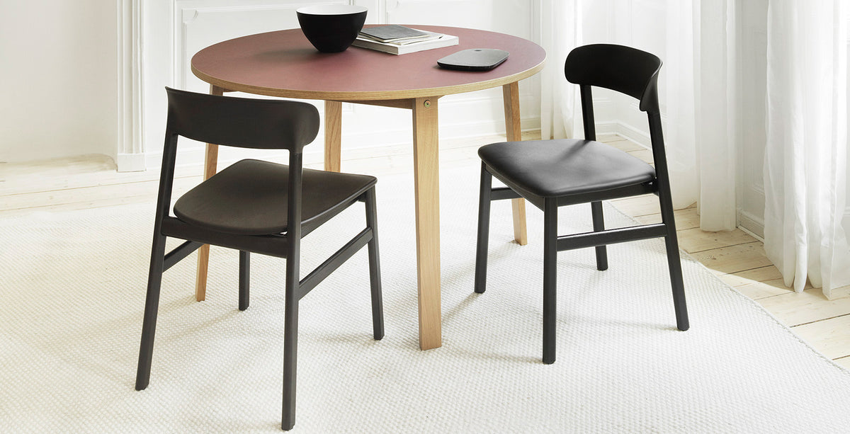 Herit Upholstery Chair by Normann Copenhagen, showing herit upholstery chair in live shot.