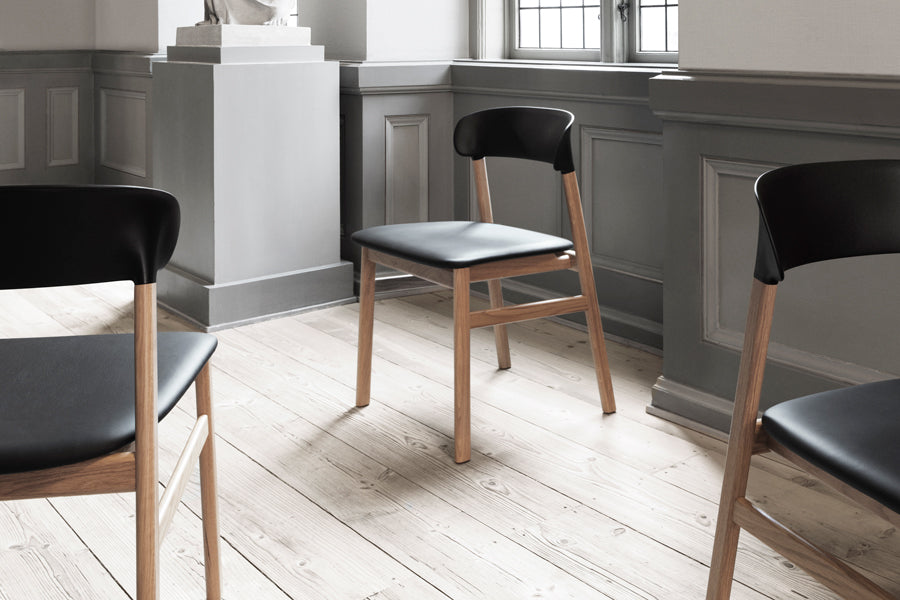 Herit Upholstery Chair by Normann Copenhagen, showing herit upholstery chairs in live shot.