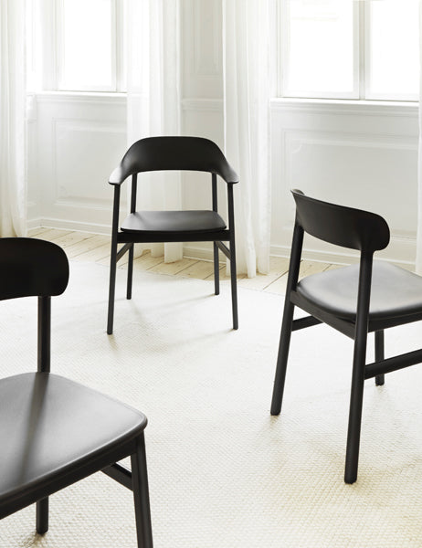 Herit Upholstery Chair by Normann Copenhagen, showing herit upholstery chairs in live shot.