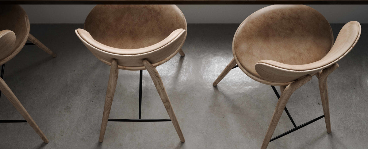 High Stool with Backrest by Mater, showing high stools with backrests in live shot.