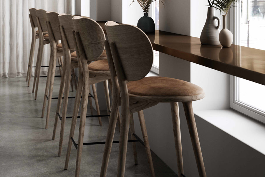 High Stool with Backrest by Mater, showing high stools with backrests in live shot.