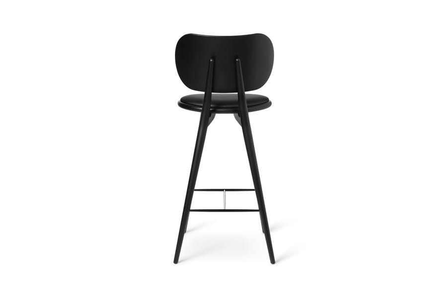 High Stool with Backrest by Mater, showing back view of high stool with backrest in black stained beech wood/black leather seat.