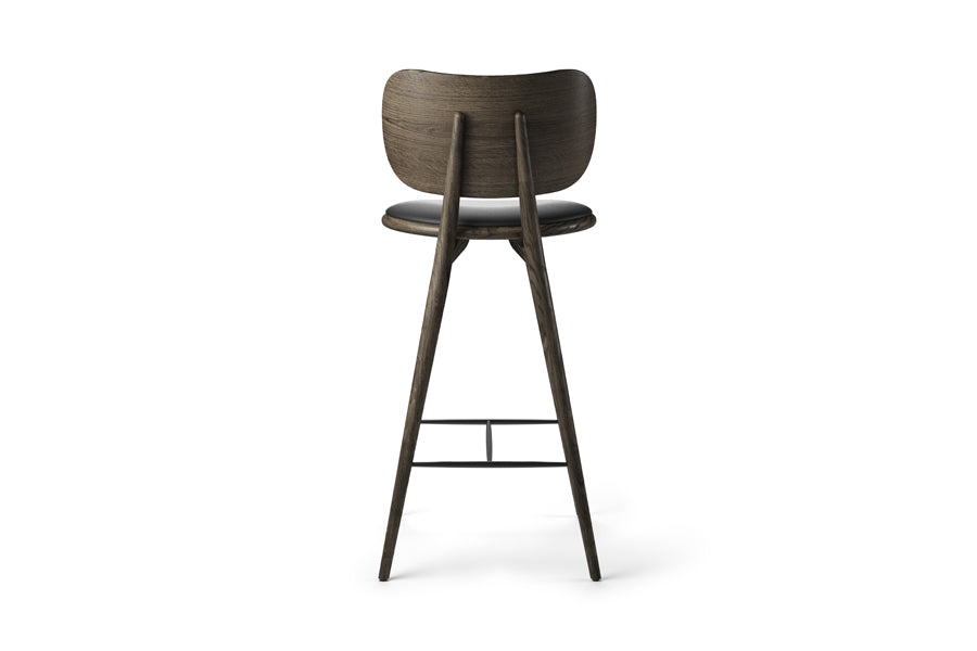 High Stool with Backrest by Mater, showing back view of high stool with backrest in sirka grey stained oak/black leather seat.