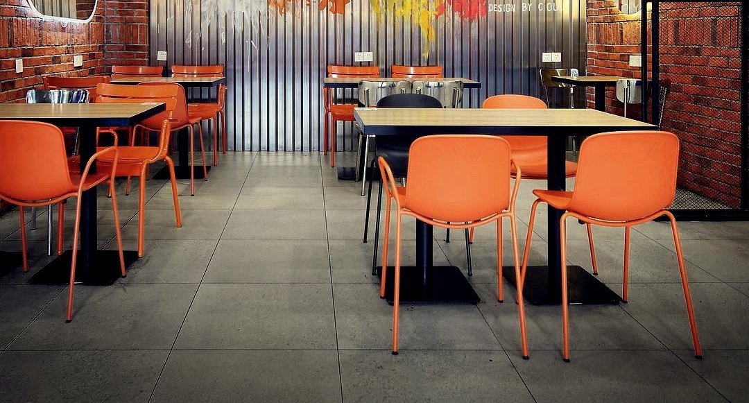 Holi Arm Chair by Toou, showing of arm chairs with tables in live shot.