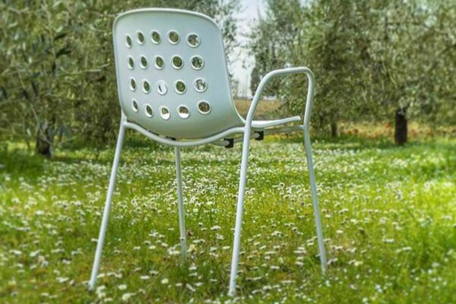 Holi Arm Chair by Toou, showing angle view of arm chair in the live shot.