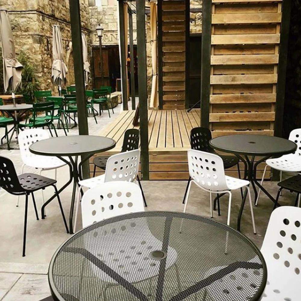 Holi Side Chair by Toou, showing top view of side chair with table in the live shot.