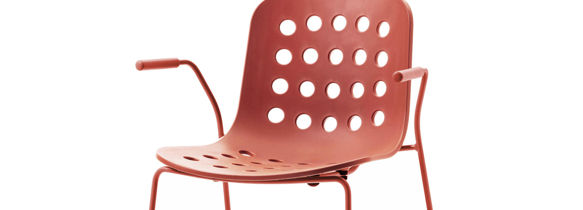 Holi Sled Base Armchair by Toou, showing closeup view of holi sled base armchair in open shell/red terracotta.