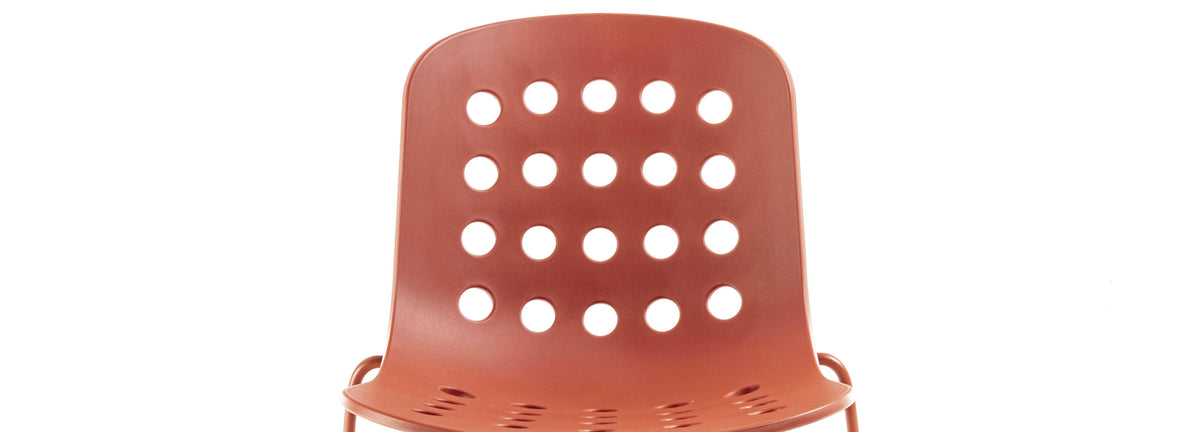 Holi Sled Base Side Chair by Toou, showing closeup view of holi sled base side chair in open shell/red terracotta.