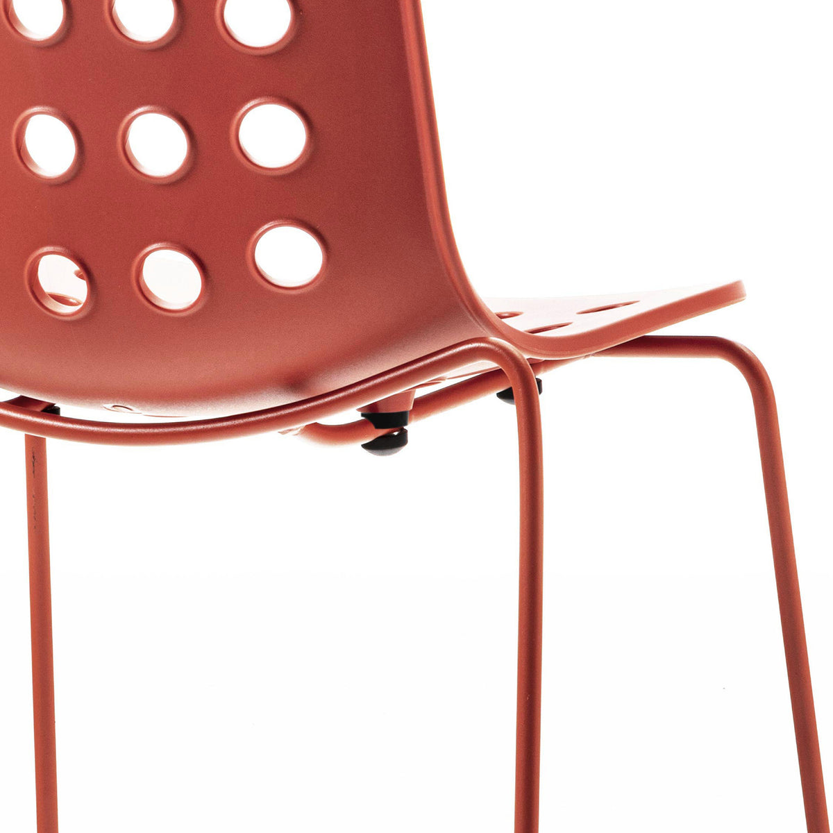 Holi Sled Base Side Chair by Toou, showing closeup view of holi sled base side chair in open shell/red terracotta.