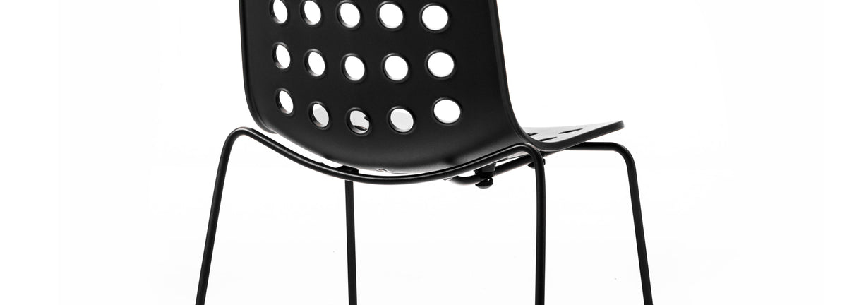 Holi Sled Base Side Chair by Toou, showing closeup view of holi sled base side chair in open shell/black.