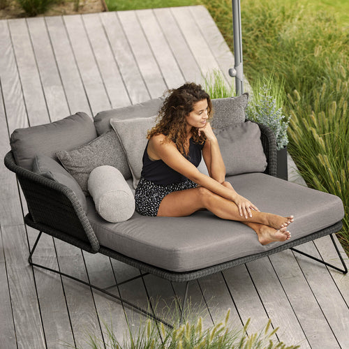 Horizon Outdoor Daybed by Cane-Line, showing horizon outdoor daybed in live shot.