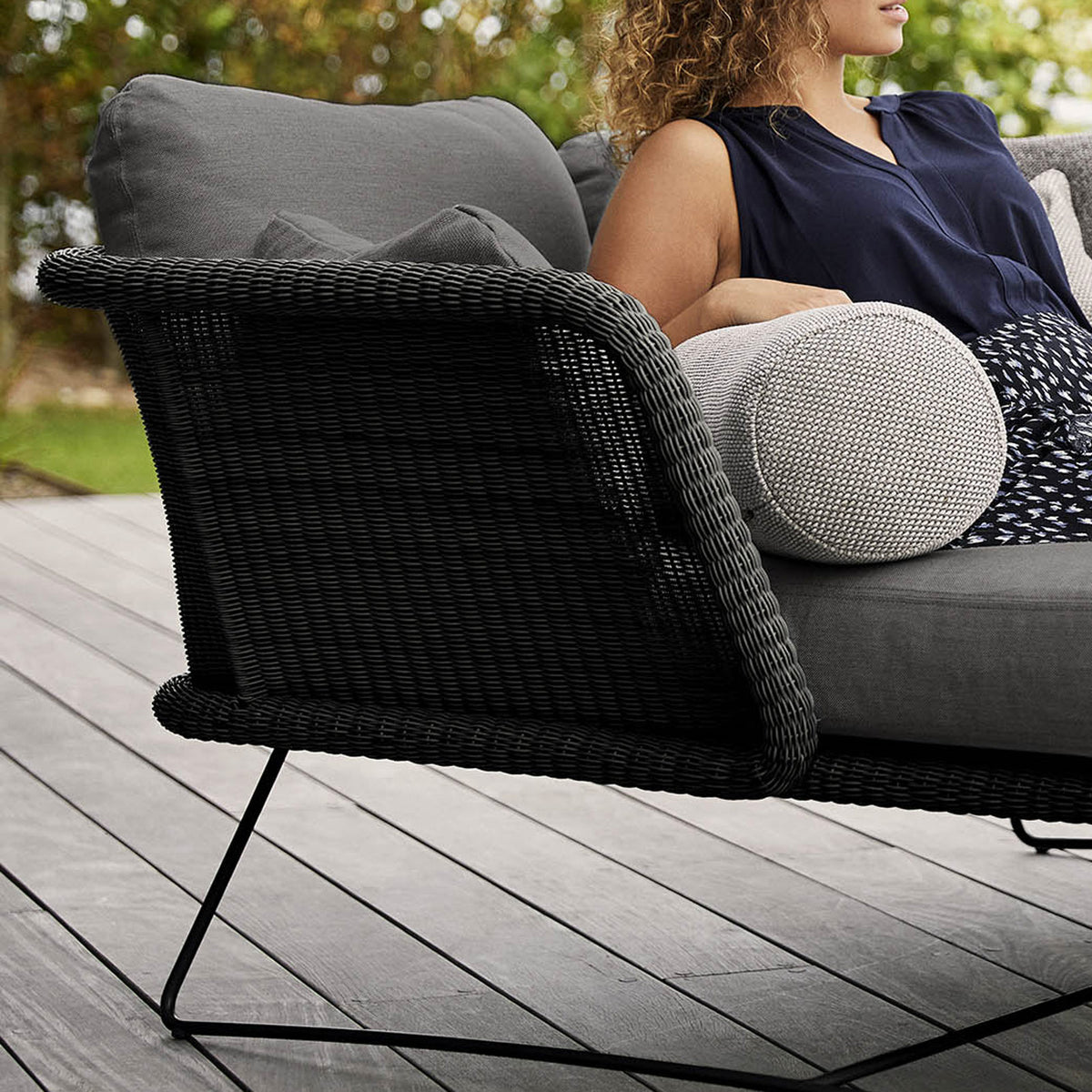 Horizon Outdoor Daybed by Cane-Line, showing closeup view of horizon outdoor daybed in live shot.