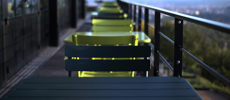 Luxembourg Stacking Side Chair by Fermob, showing live shoot of the side chair with table.