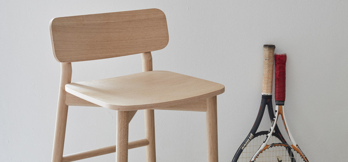 Hven Oak Low Bar Stool by Skagerak, showing hven oak low bar stool in live shot.