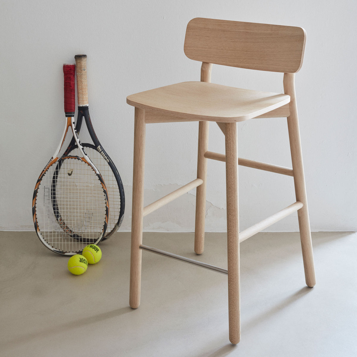 Hven Oak Low Bar Stool by Skagerak, showing hven oak low bar stool in live shot.