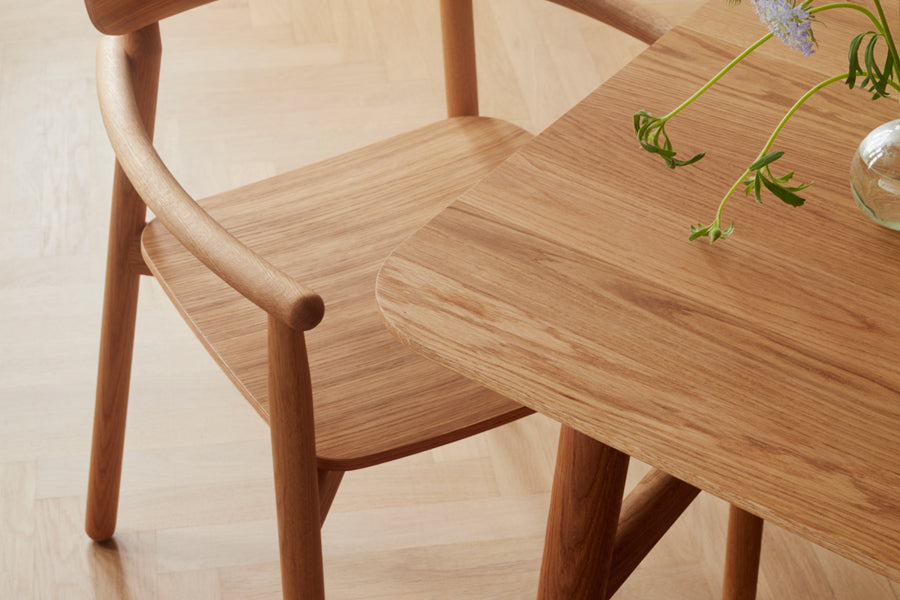 Hven Table by Skagerak, showing closeup view of hven table with chair in live shot.