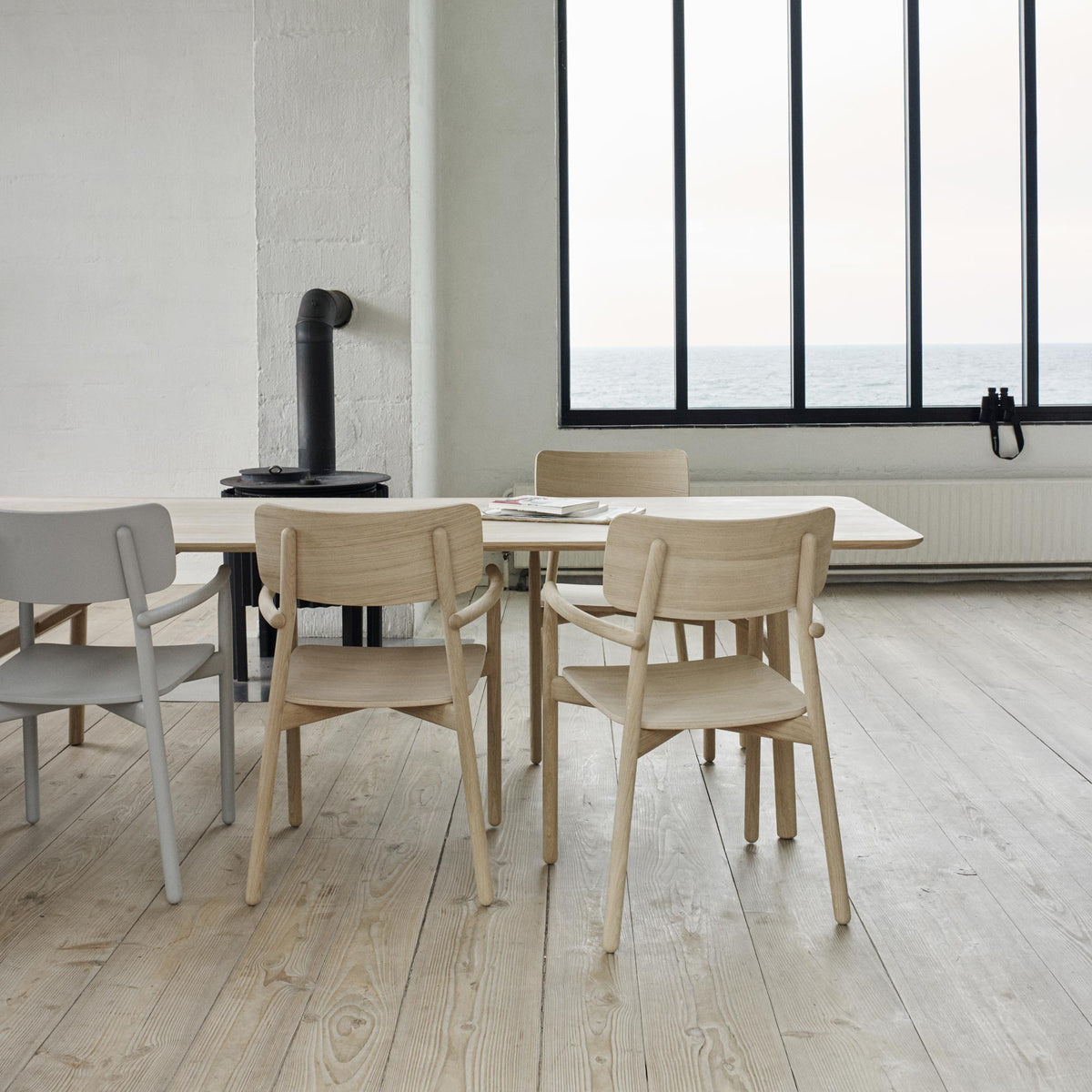 Hven Table by Skagerak, showing hven table with chairs in live shot.