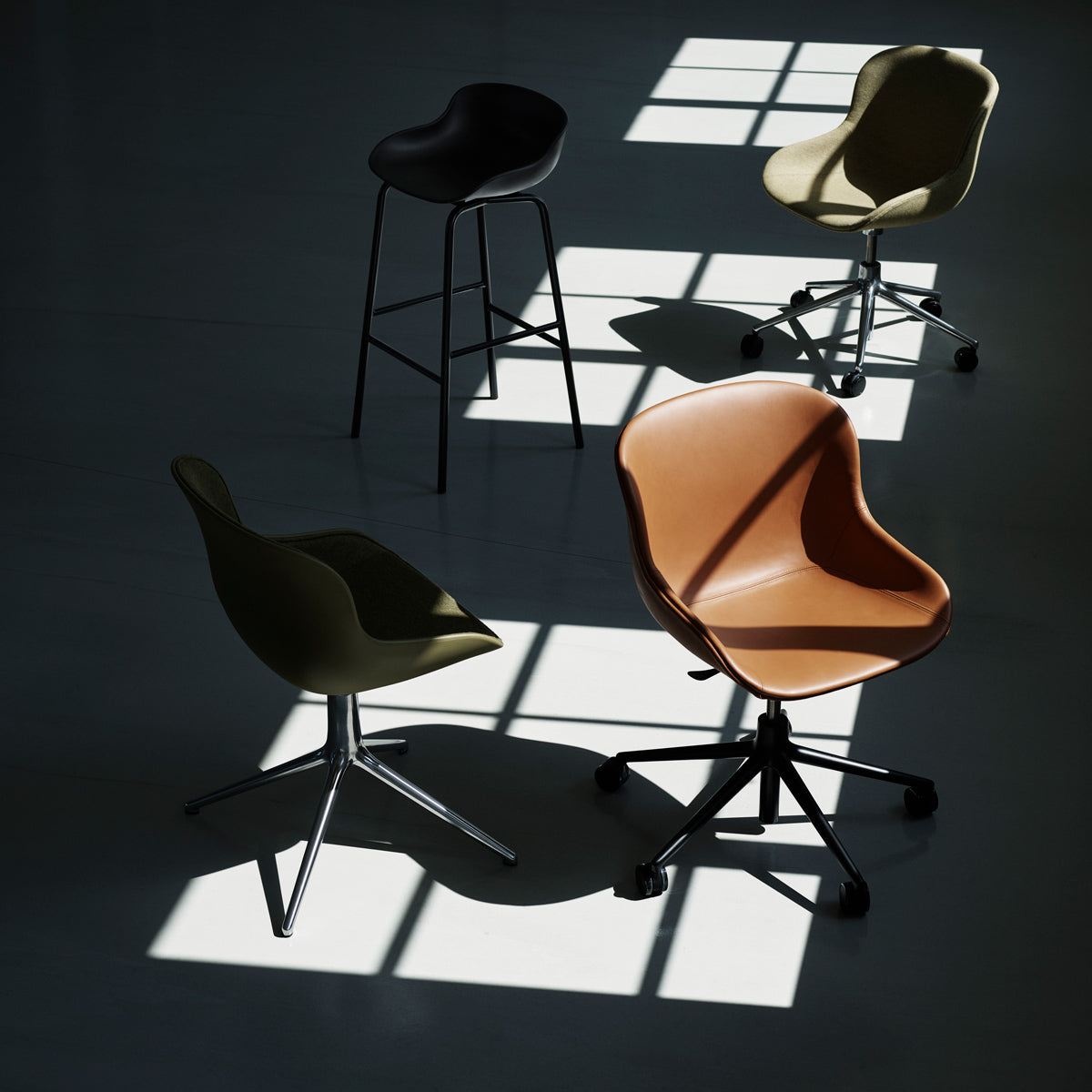 Hyg Swivel Chair by Normann Copenhagen, showing hyg swivel chair in live shot.